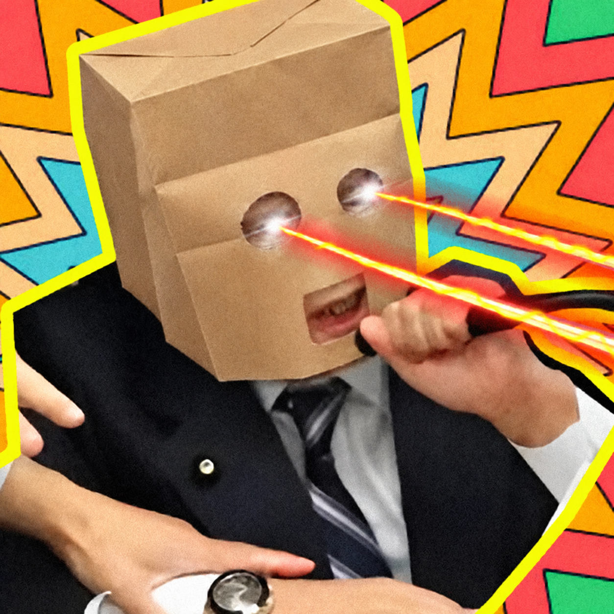 Anonymous WOULD wearing a cardboard mask and firing laser beams